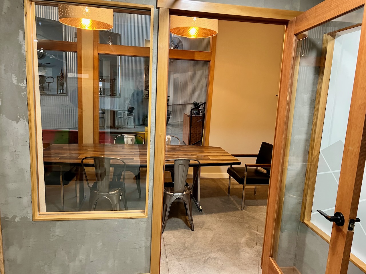 Glass-enclosed meeting pods
